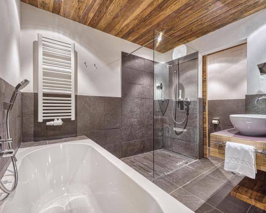 Bathroom with shower and bathtub - Alex Natural Wood Room