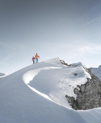 A couple during a snowshoe hike