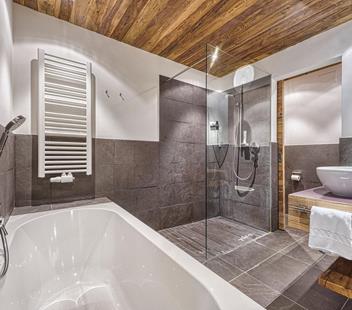 Bathroom with shower and bathtub - Alex Natural Wood Room