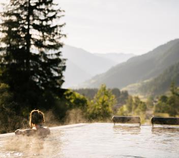 A woman relaxes in the heated sky pool