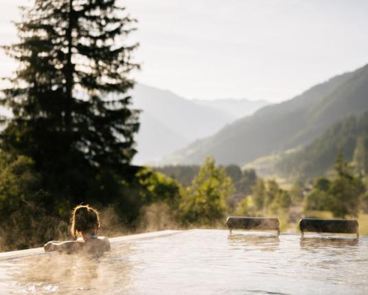 A woman relaxes in the heated sky pool