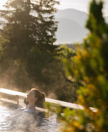 A woman relaxes in the heated sky pool