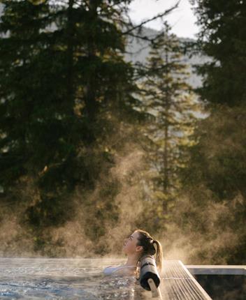 A woman relaxes in the heated sky pool